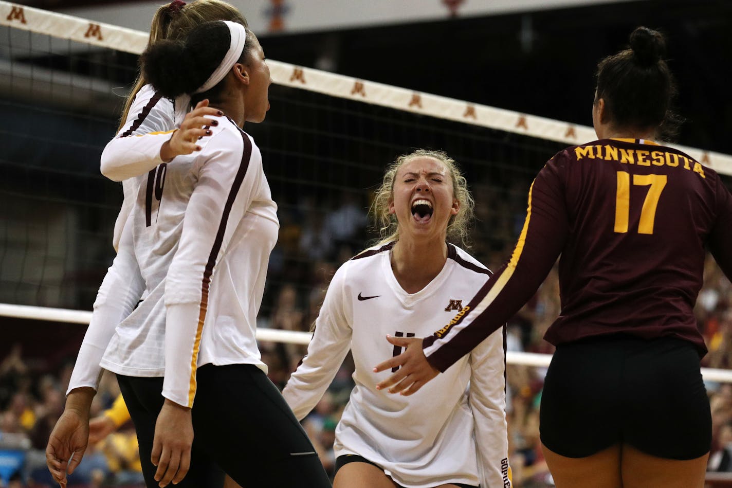 Setter Samantha Seliger-Swenson (middle, shown celebrating a point against Michigan in September) excels at getting the volleyball to the Gophers' young but talented hitters.