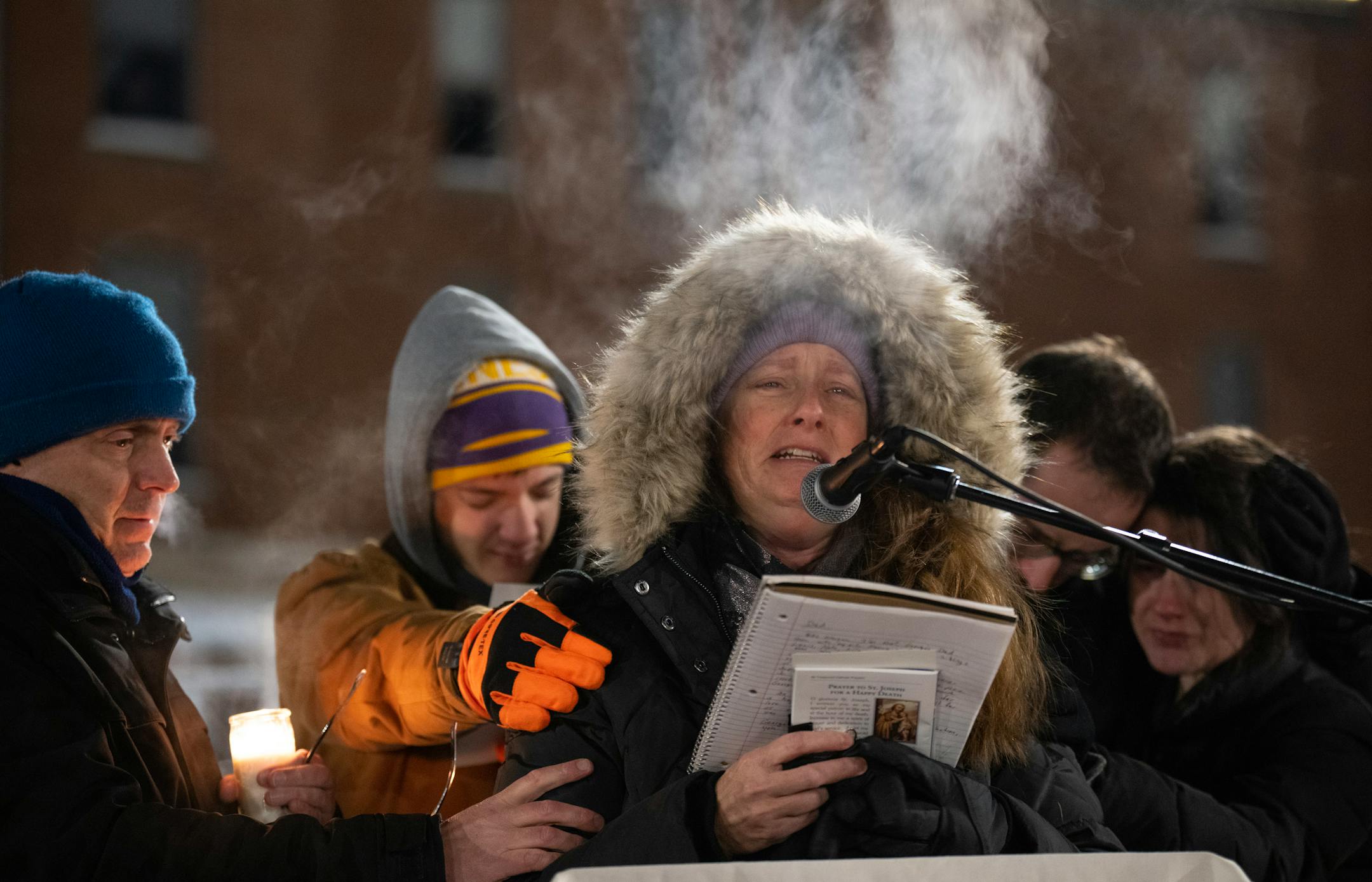 Nancy Musser, with her husband Kent supporting her at left, told the crowd gathered at a vigil for their son, George, "The only peace I have is in the Good Lord and in his love and mercy, and in all of your beautiful faces here tonight."