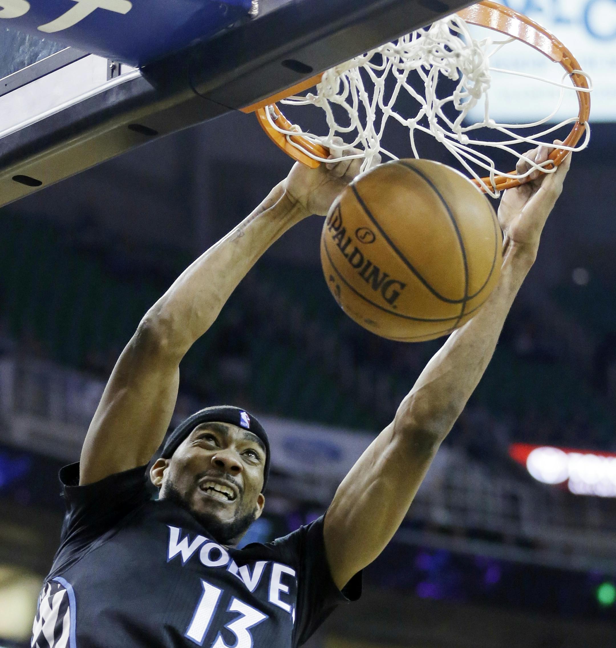 Minnesota Timberwolves' Corey Brewer (13) dunks the ball against the Utah Jazz in the second half during an NBA basketball game, Tuesday, Jan. 21, 2014, in Salt Lake City. The Timberwolves won 112-97. (AP Photo/Rick Bowmer)