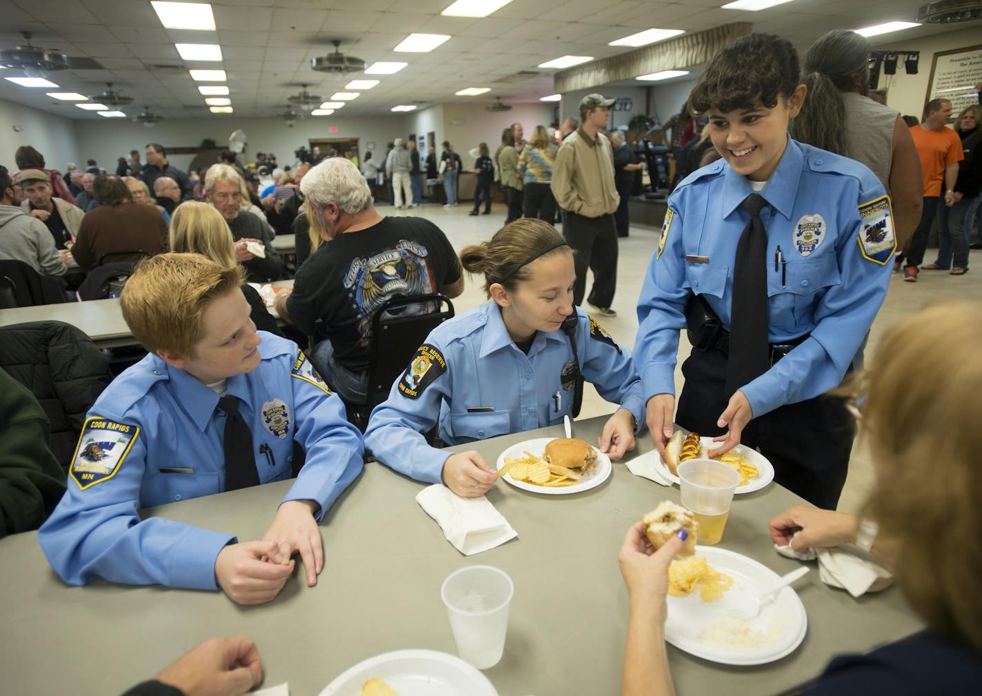 From left, Coon Rapids Police explorer Jason Ford, reserve officer Courtney Nothnagel and explorer Norkhadijah Lindgren were some of the attendees of Friday night's pro-police rally in Coon Rapids. ] (AARON LAVINSKY/STAR TRIBUNE) aaron.lavinsky@startribune.com A pro-police rally and concert in was held at the American Legion Post in Coon Rapids on Friday, Oct. 23, 2015.