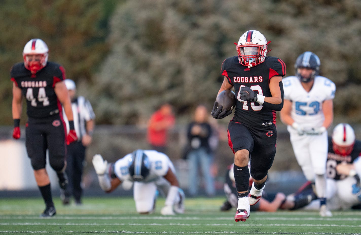 Centennial running back Maverick Harper (43) breaks out for a long rushing touchdown against Blaine in the first quarter Friday, Sep. 08, 2023, at Centennial High School in Circle Pines, Minn. ]