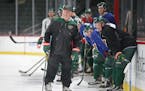 Minnesota Wild head coach Bruce Boudreau watched drills from the ice during the first day of practice