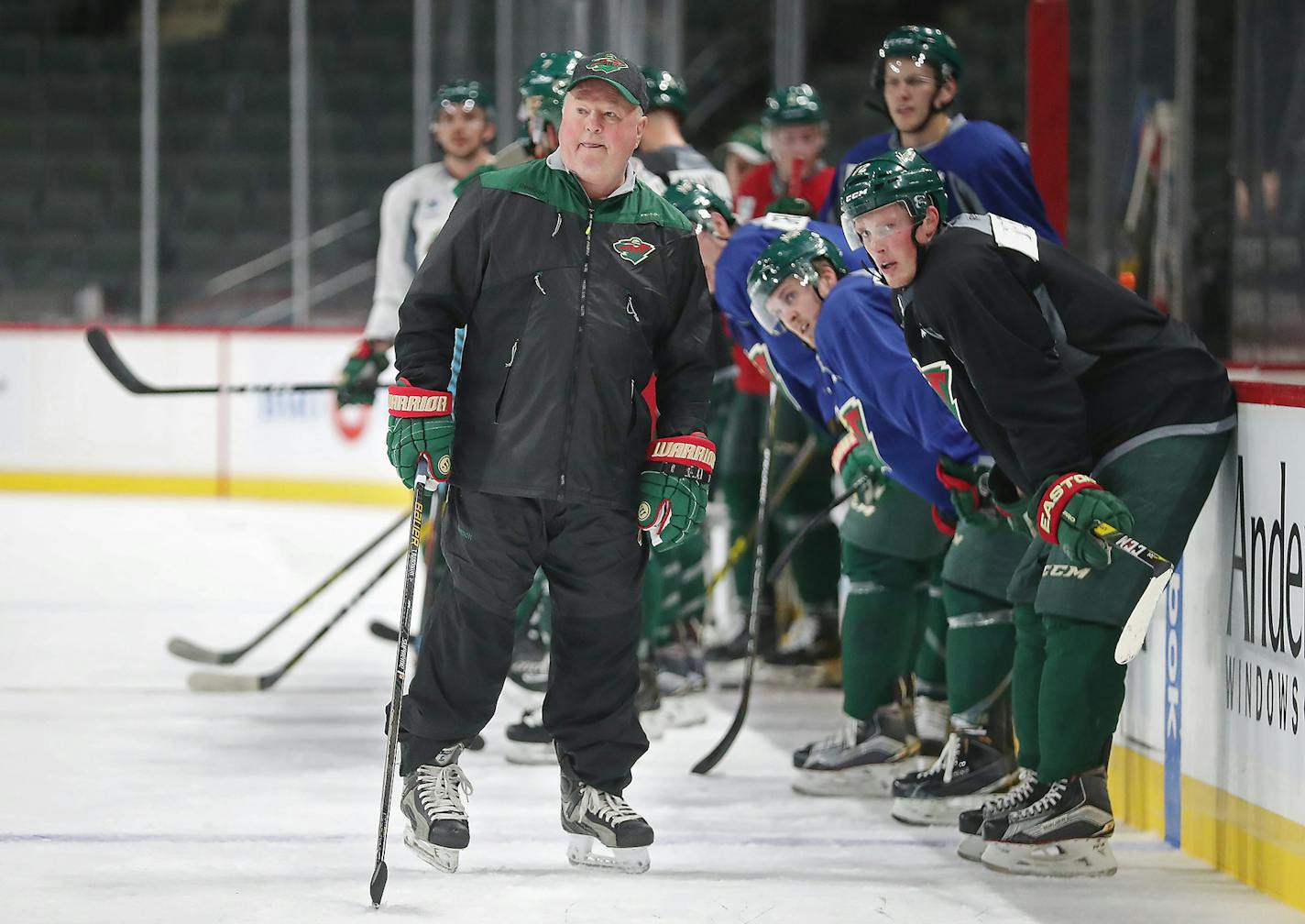 Minnesota Wild head coach Bruce Boudreau watched drills from the ice during the first day of practice