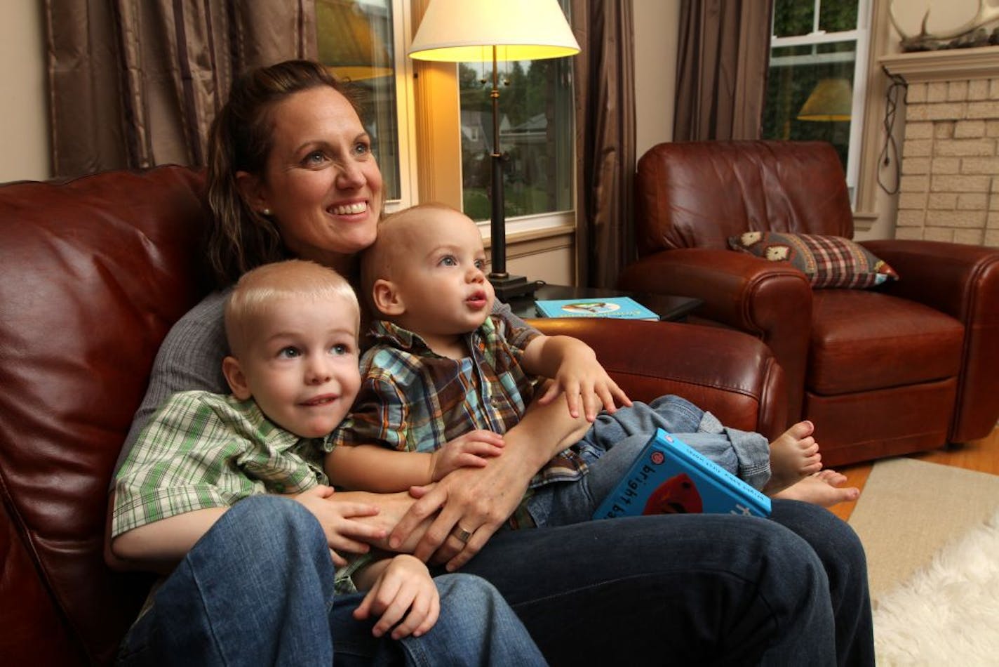 Mikki Denney Wright held her two reasons for resigning as Gophers women's soccer coach: her sons, from left, Forrest, 3, and Duke, 1.