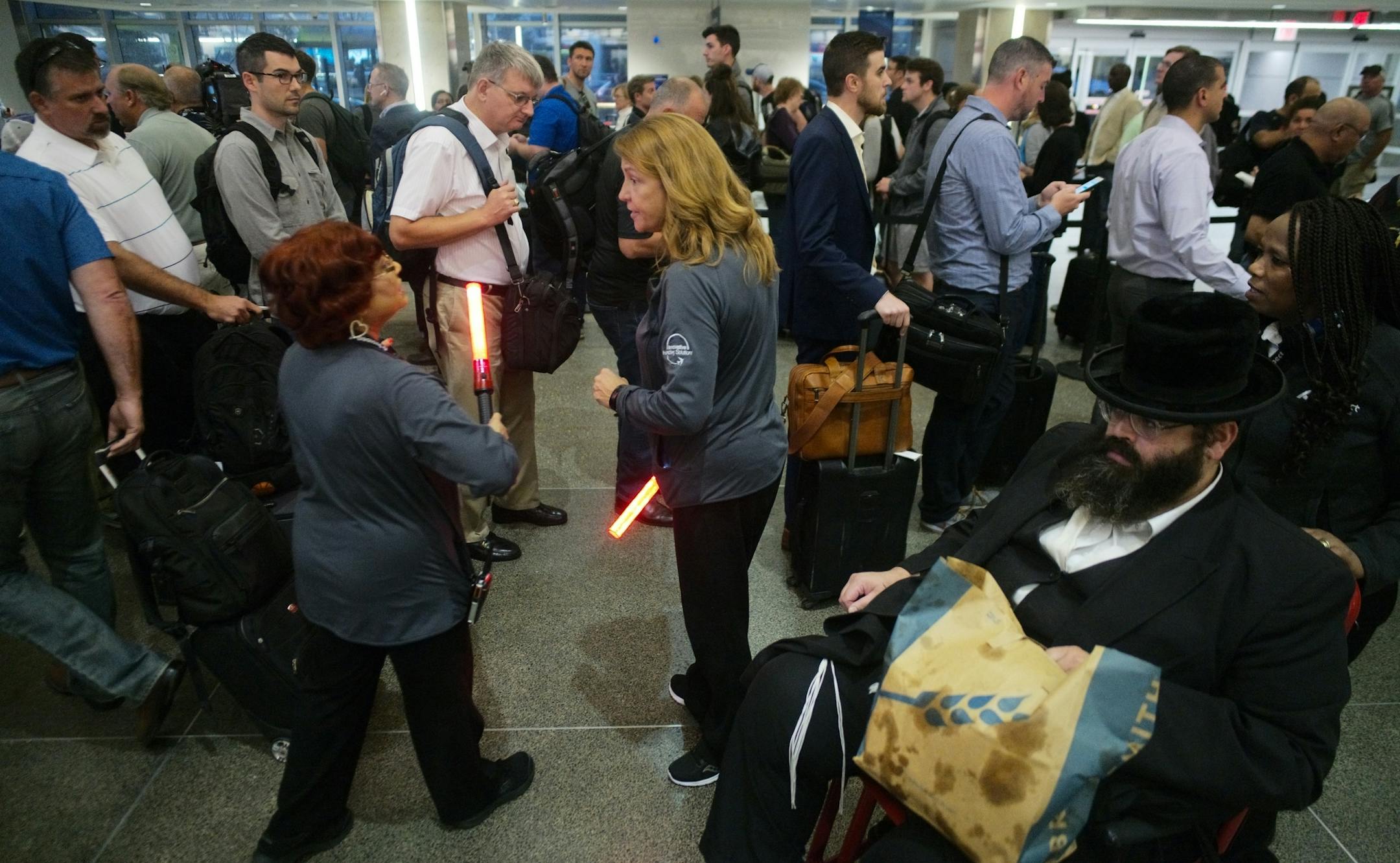 Maharanie Raghubir,left, and Amy Haley helped direct people to security.