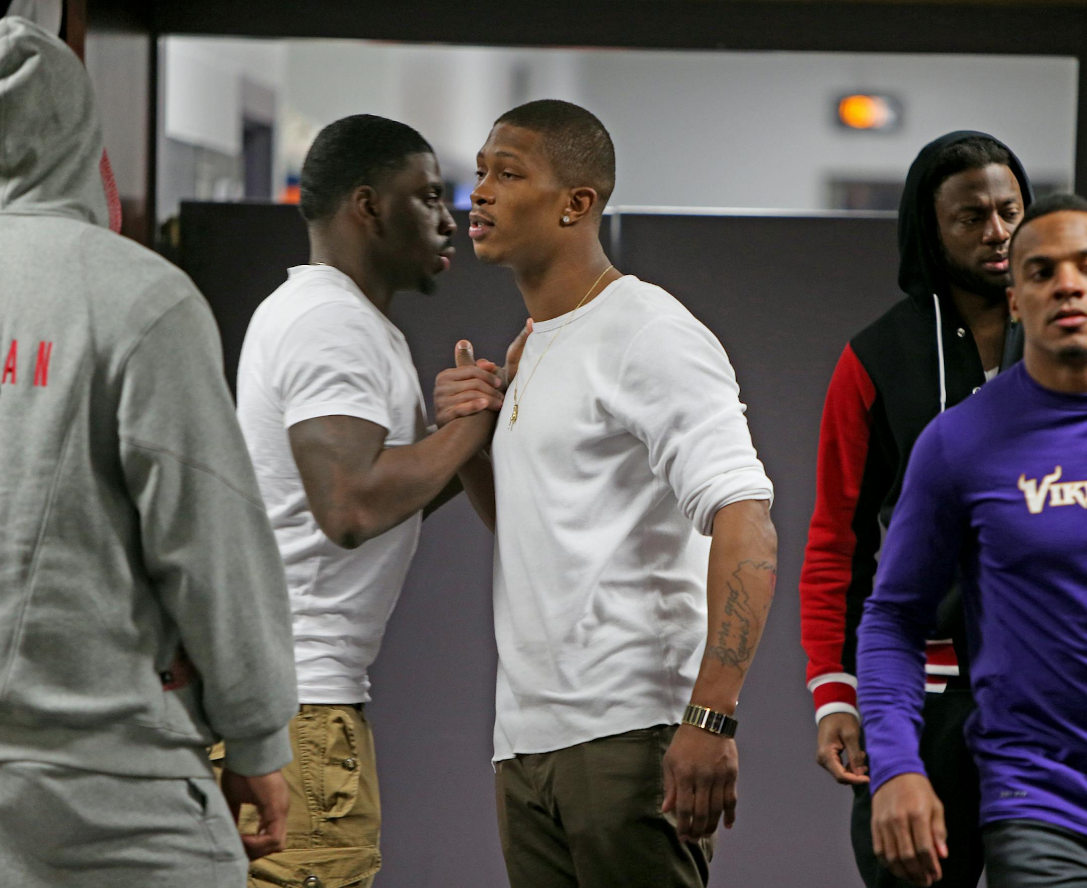Minnesota Vikings cornerback Chris Cook, center, said goodbye to teammates in the locker room, Monday, December 30, 2013 at Winter Park in Eden Prairie, MN. (ELIZABETH FLORES/STAR TRIBUNE) ELIZABETH FLORES • eflores@startribune.com