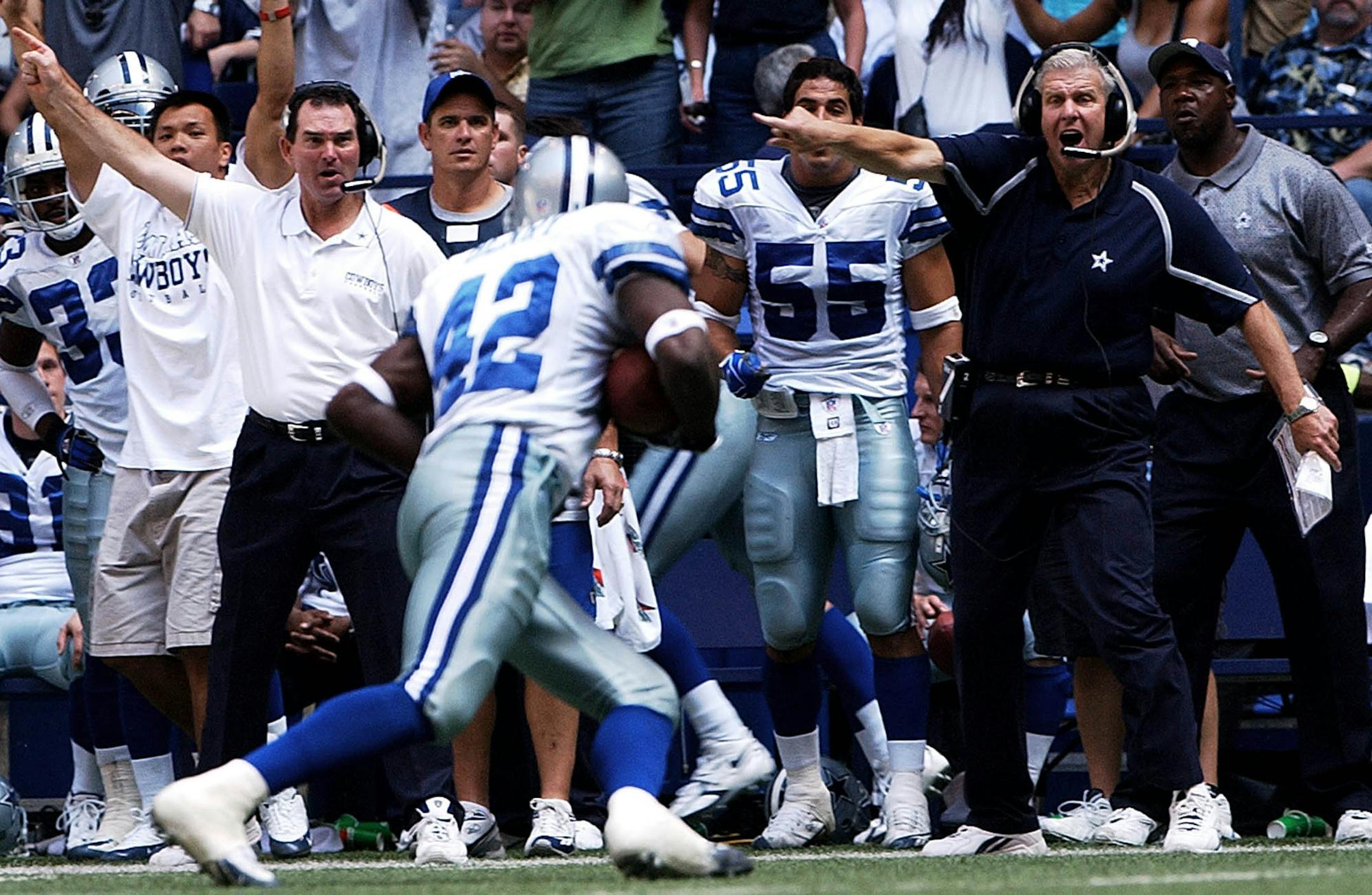 Dallas Cowboys head coach Bill Parcells, right, and defensive coordinator Mike Zimmer point the direction Anthony Henry (42) should run after he intercepted a pass against the New York Giants in the fourth quarter in Irving, Texas, Sunday, Oct. 16 , 2005. The Cowboys won 16-13 in overtime. (AP Photo/Amy Conn-Gutierrez) ORG XMIT: IRV108