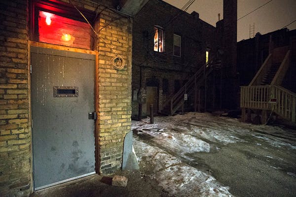 The backdoor type entrance at Volstead's Emporium in Uptown is in an alley through a door with a peep slot.