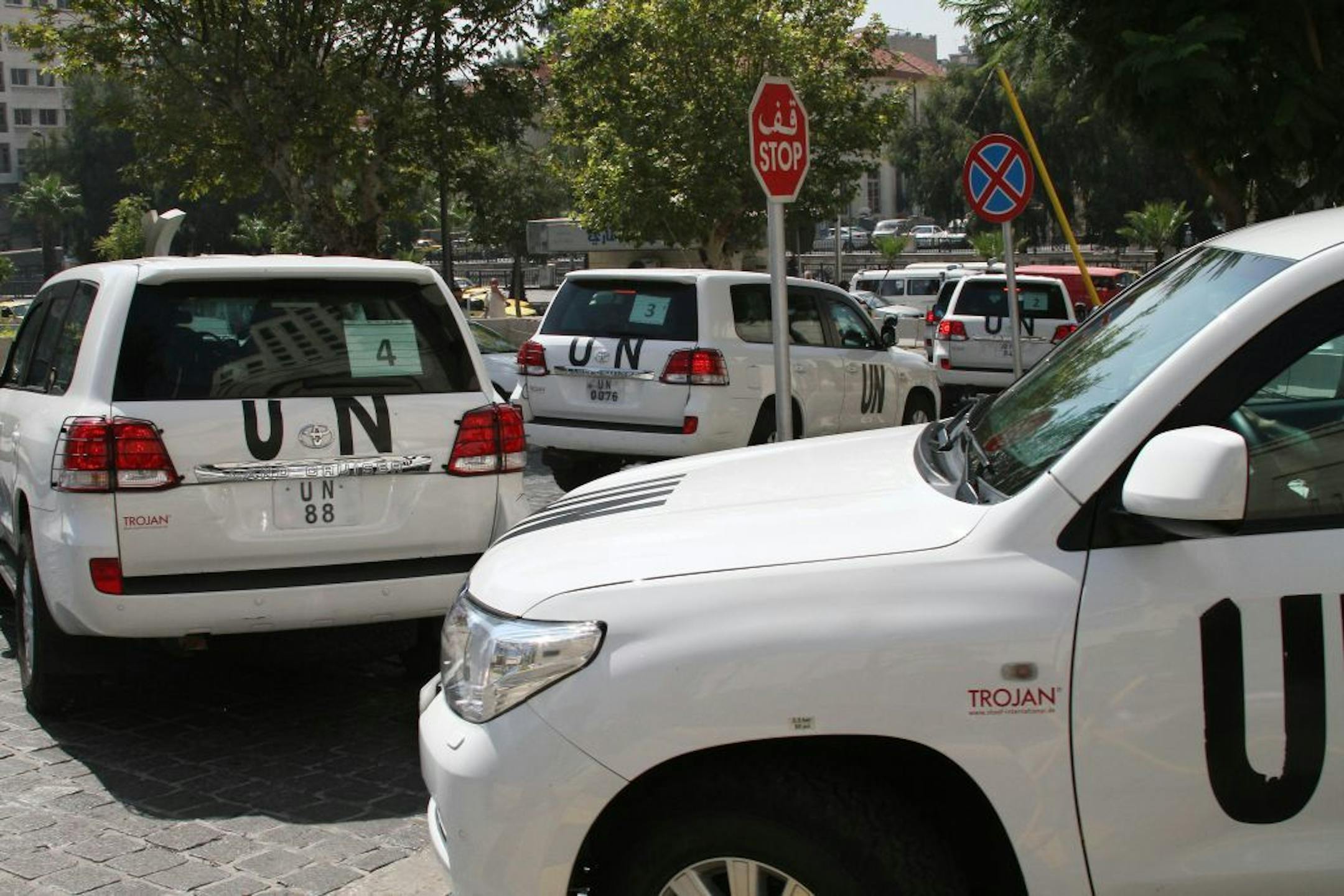 A U.N. team, that is scheduled to investigate an alleged chemical attack that killed hundreds last week in a Damascus suburb, leaves their hotel in a convoy, in Damascus, Syria, Monday, Aug. 26, 2013.
