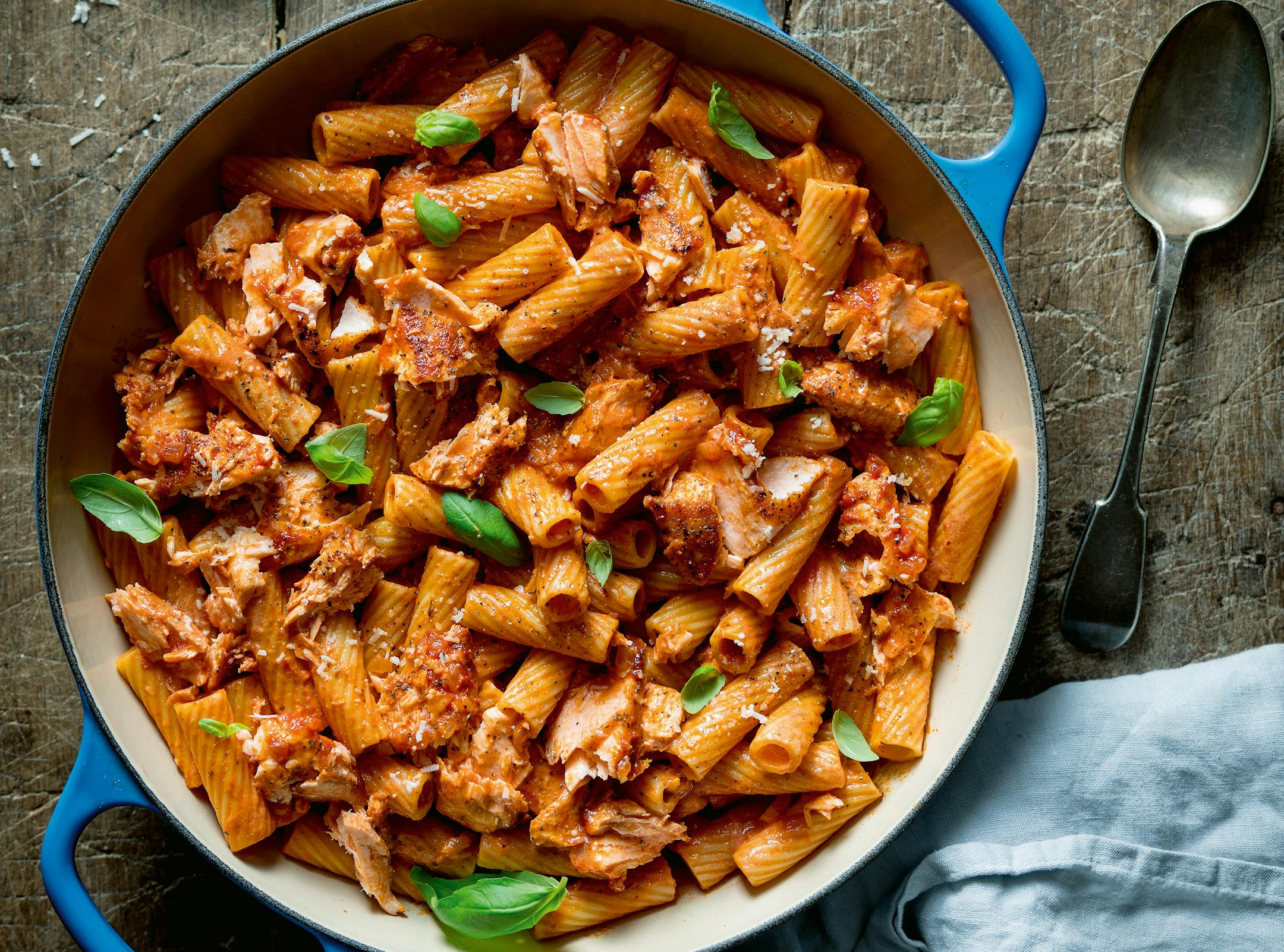 Tomato Salmon Pasta from "It's All About Dinner: Easy, Everyday, Family-Friendly Meals," by Nicky Corbishley (Kyle Books 2022); Photography by Nicky Corbishley