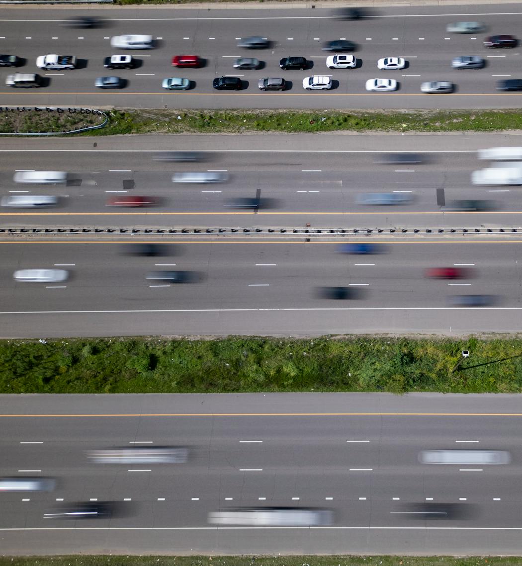 Traffic moves along I-94 south of downtown during afternoon rush hour on June 27. 