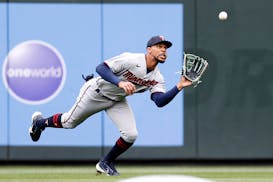 Byron Buxton (25) of the Minnesota Twins catches the ball for an out against the Seattle Mariners during the first inning at T-Mobile Park on Wednesda