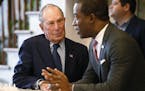 Democratic presidential candidate, former New York Mayor Michael Bloomberg, left, chats with Richmond Mayor Levar Stoney at a coffee shop in Richmond,