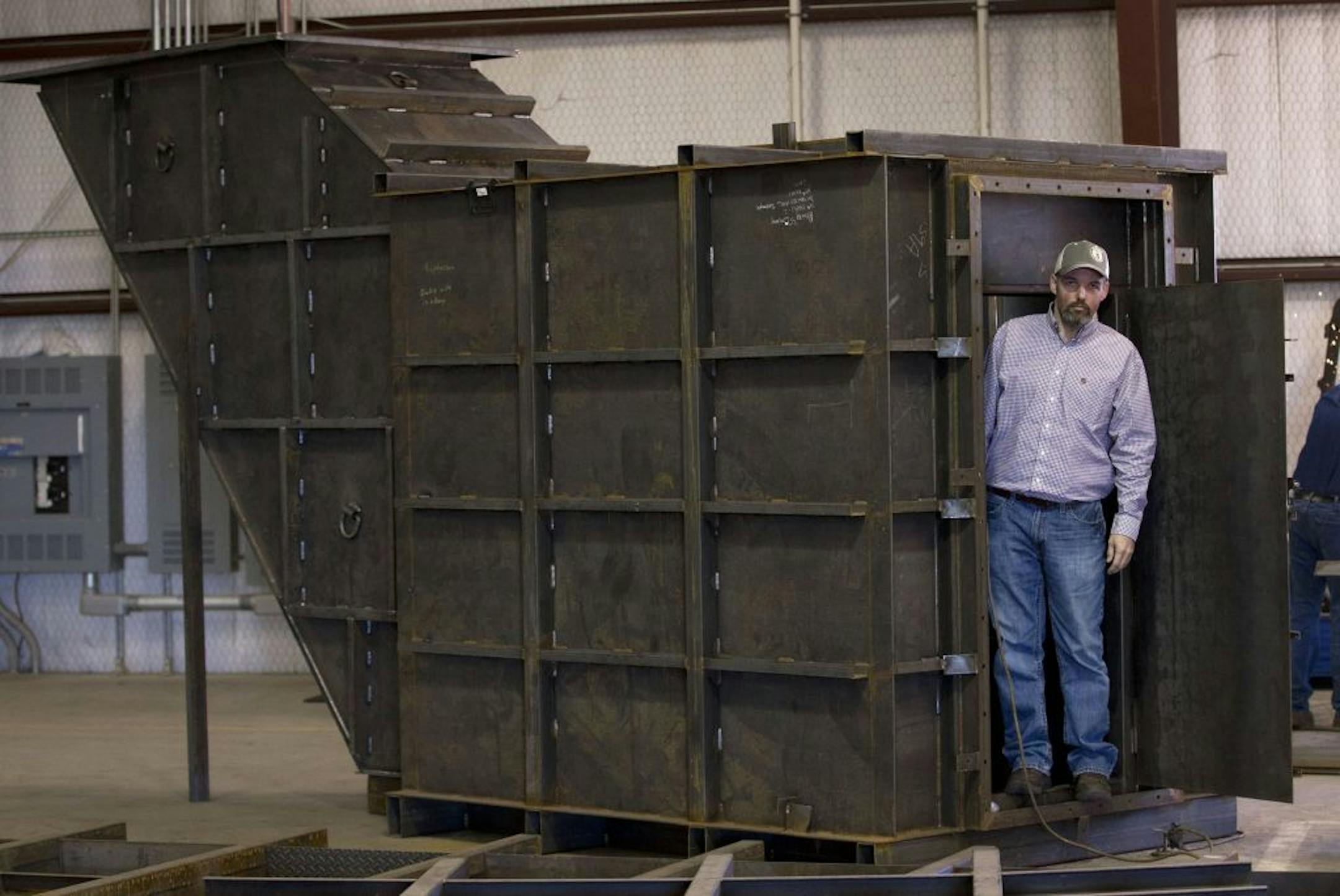Gary Lynch with a bomb shelter under construction at Rising S Co.