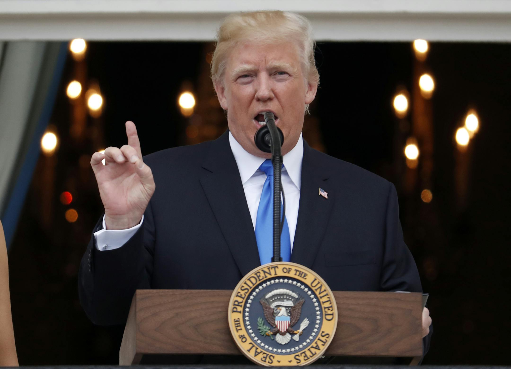 President Donald Trump speaks from the Truman Balcony at the Fourth of July picnic for military families on the South Lawn of the White House, Tuesday, July 4, 2017, in Washington. (AP Photo/Alex Brandon)