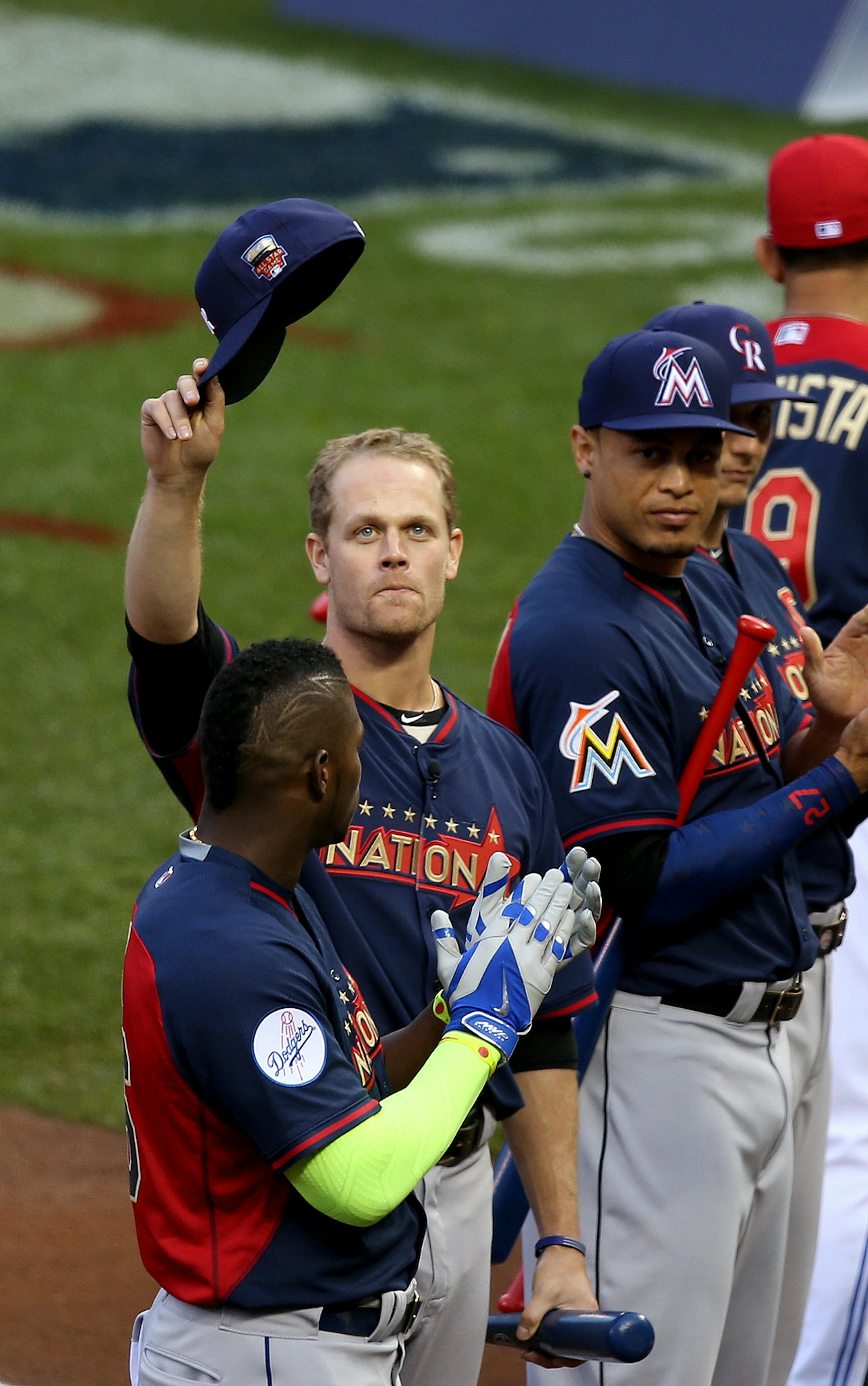 Justin Morneau tips his hat to fans during his introduction. ] (KYNDELL HARKNESS/STAR TRIBUNE) kyndell.harkness@startribune.com During the All-Star Home run Derby at Target Field in Minneapolis, Min. Monday, July 14, 2014.