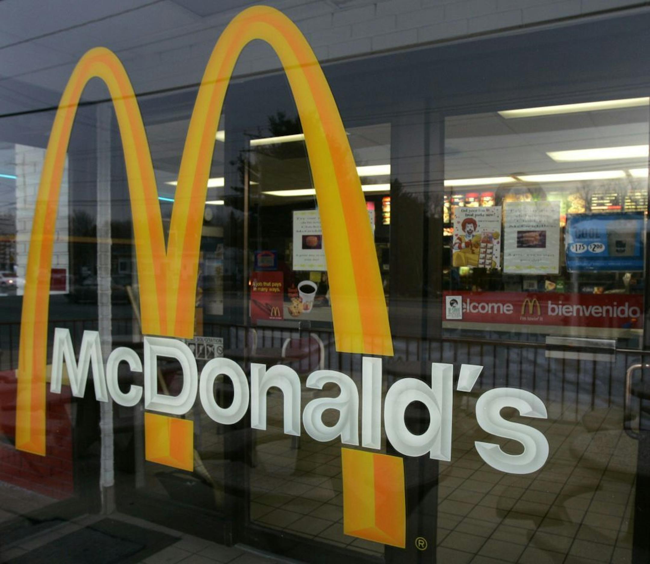 A McDonalds sign welcomes patrons into the restaurant in Wilmington, Del. in this Jan. 24, 2007 file photo. McDonald's Corp., the world's No. 1 hamburger chain, on Monday, Jan. 28, 2008 said its fourth-quarter profit climbed 3 percent due to income tax benefits and yet another period of strong sales at stores open at least a year.