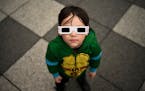 Owen Kloncz, 4, looks up to the sky to try to find the sun and the solar eclipse on Monday at the Science Museum of Minnesota in St. Paul.