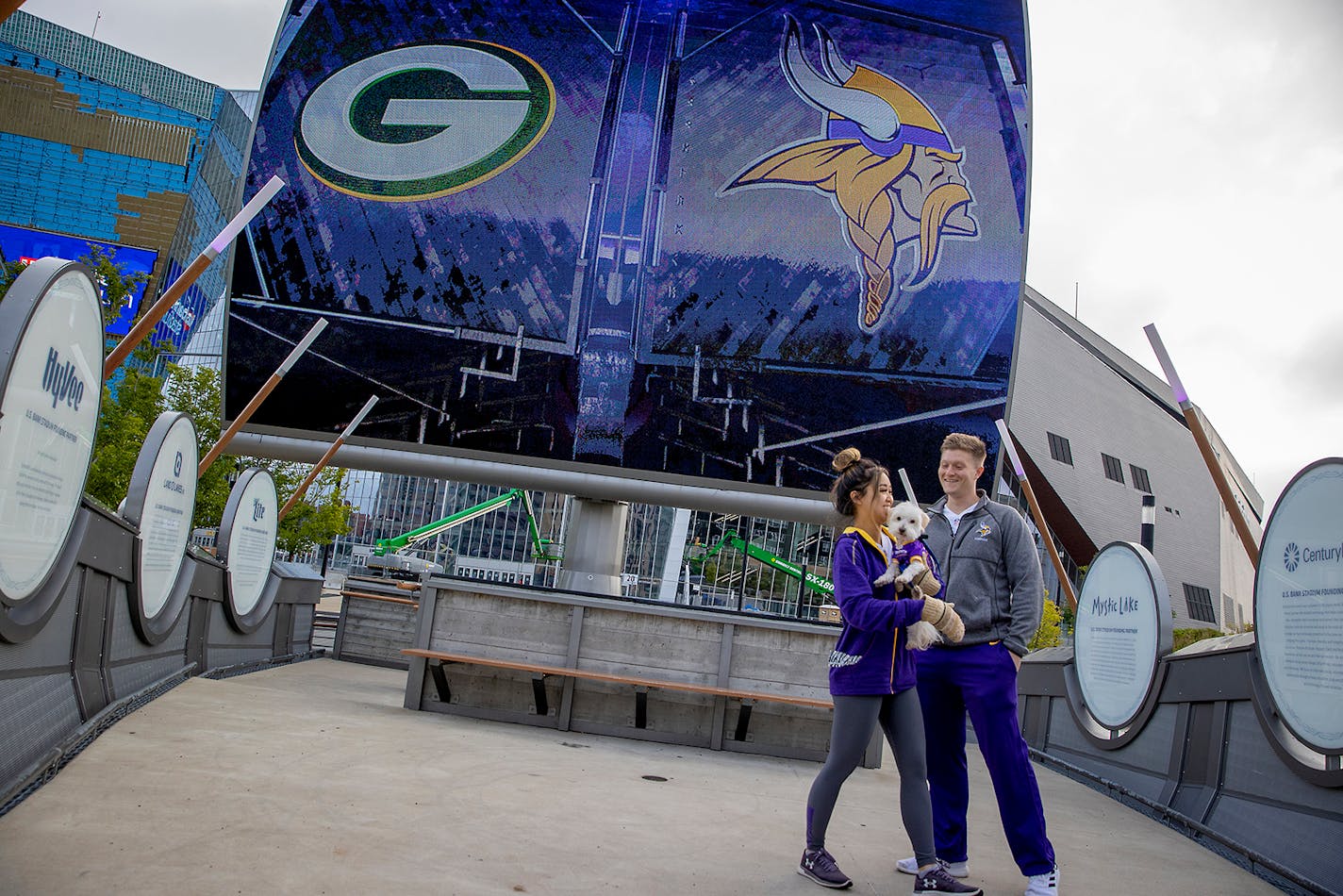 Vikings fans Chris Fowler and Kim Nguyen took in the very quiet scene with their dog "Scout" before the Vikings took on the Green Bay Packers at U.S. Bank Stadium, Sunday, Sept. 13, 2020 in Minneapolis. Fowler moved here from Florida after buying season tickets.