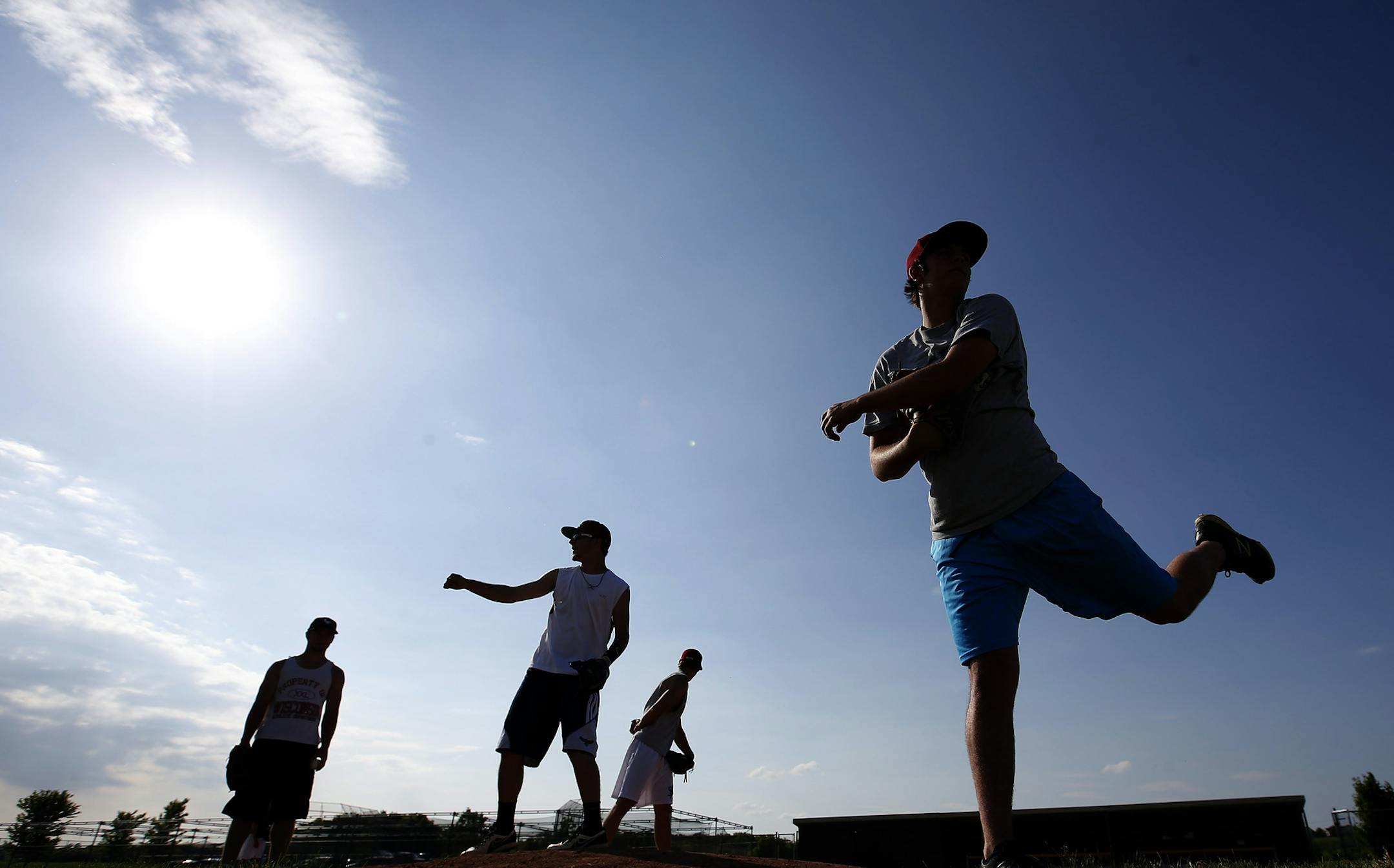 Lakeville South pitchers worked on their pickoffs during practice on Tuesday. ] CARLOS GONZALEZ cgonzalez@startribune.com - June 10, 2014, Lakeville, Minn., Lakeville South High school prep baseball practice. team working out and doing a drill that shows team unity. They found some late chemistry to win their section playoffs after just winning two games all season.