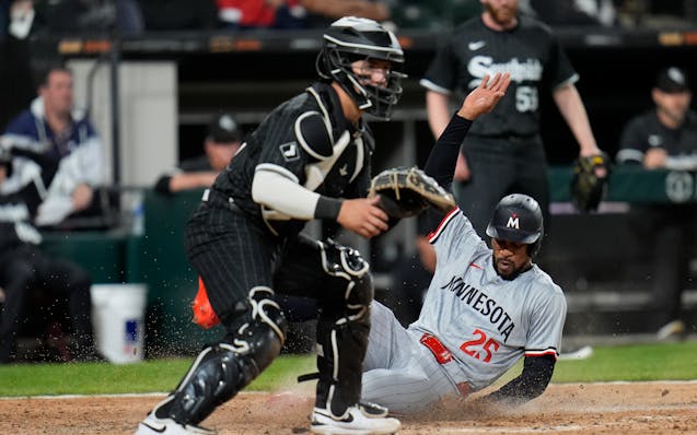 The Twins' Byron Buxton slides into home with the go-ahead run in a 3-2 victory after a single by Max Kepler in the ninth inning against the White Sox