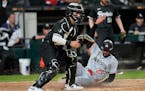 Twins center fielder Byron Buxton slides into home plate for the winning run in the ninth inning against the White Sox.