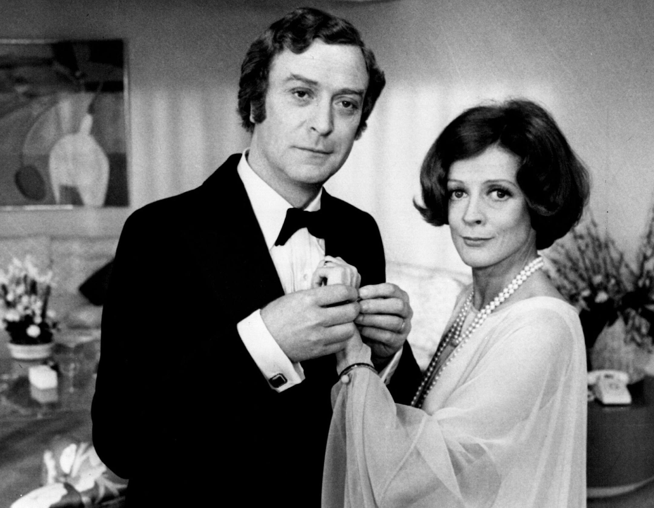 December 21, 1978 Looking very much married, Michael Caine and Maggie Smith pause while appearing in a scene from Neil Simon's "California Suite." December 20, 1978