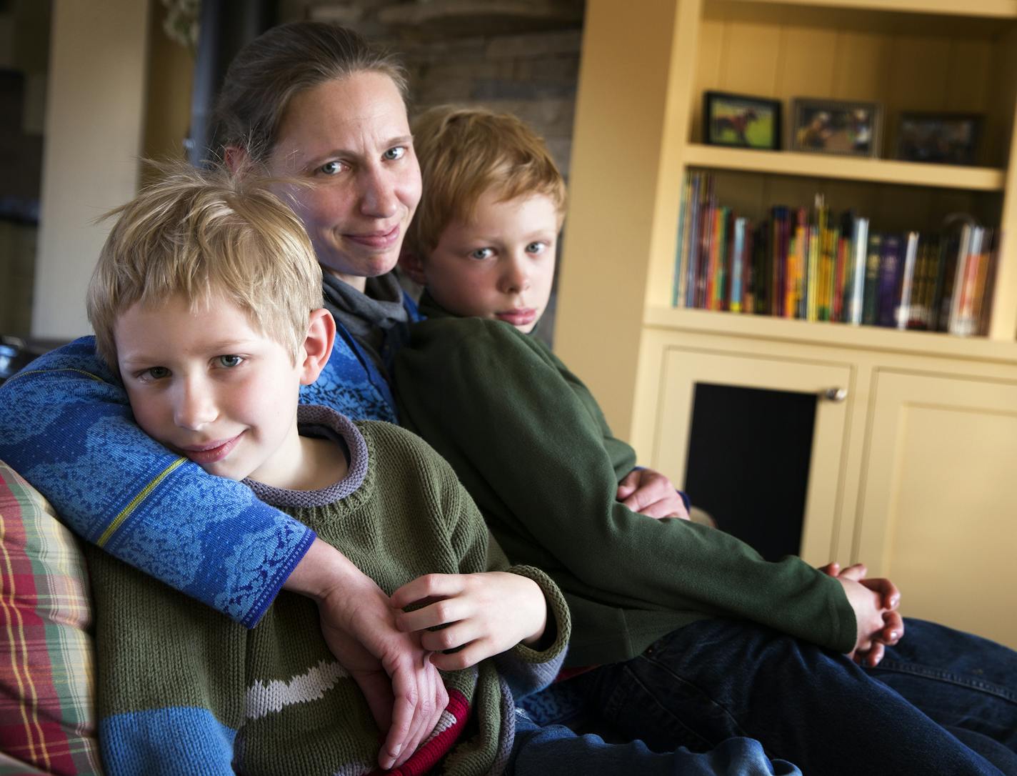 Laura Bredesen and her two sons Ben Bredesen, left, 7, and Calvin Bredesen, 9, at their home in Maple Plain, Minn. on Friday, February 6, 2015. ] LEILA NAVIDI leila.navidi@startribune.com / BACKGROUND INFORMATION: Laura Bredesen has become a public advocate for vaccination after a measles scare for her son Ben when he was undergoing chemotherapy for leukemia. The 7-year-old is now free of cancer, and last December was able to get fully vaccinated.