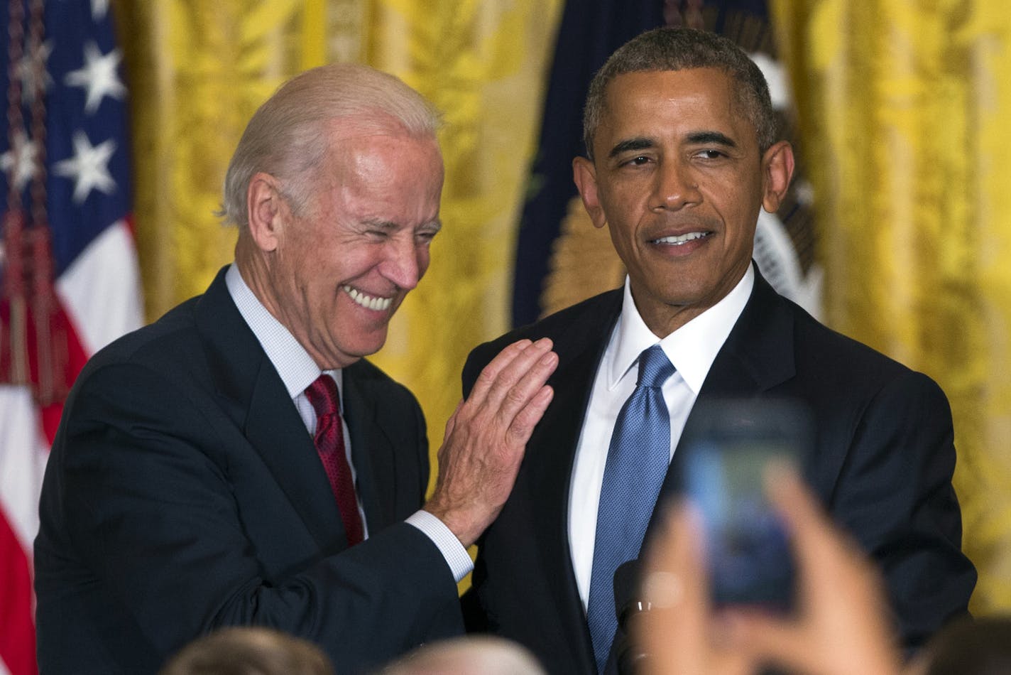 FILE - In this June 24, 2015 file photo Vice President Joe Biden and President Barack Obama speak in the East Room of the White House in Washington.