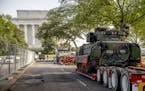 Two Bradley Fighting Vehicles are parked nearby the Lincoln Memorial for President Donald Trump's 'Salute to America' event honoring service branches 