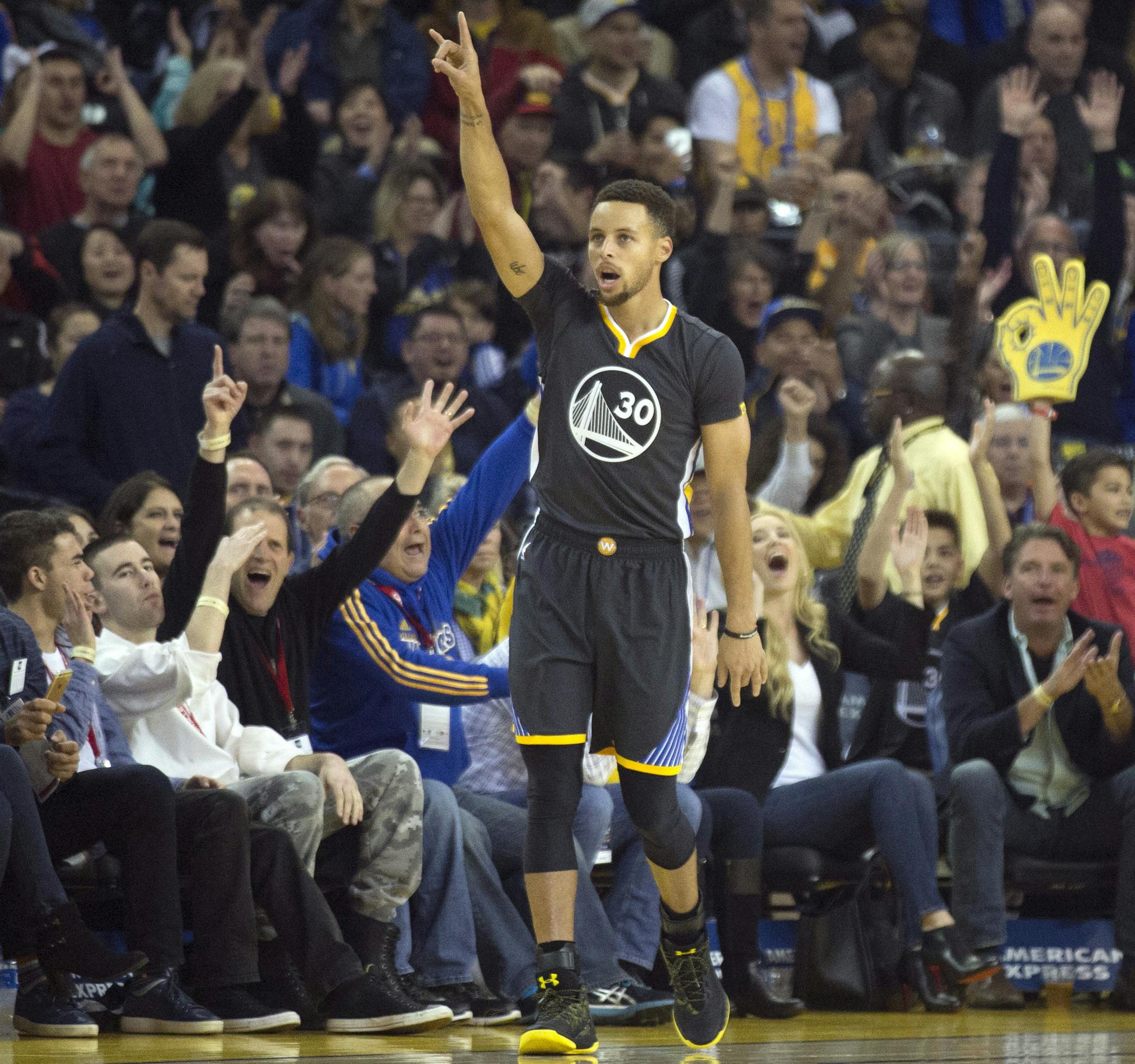Golden State Warriors' Stephen Curry (30) celebrates his 3-point basket against the Minnesota Timberwolves during the first quarter of an NBA basketball game, Saturday, Nov. 26, 2016 in Oakland, Calif. (AP Photo/D. Ross Cameron)