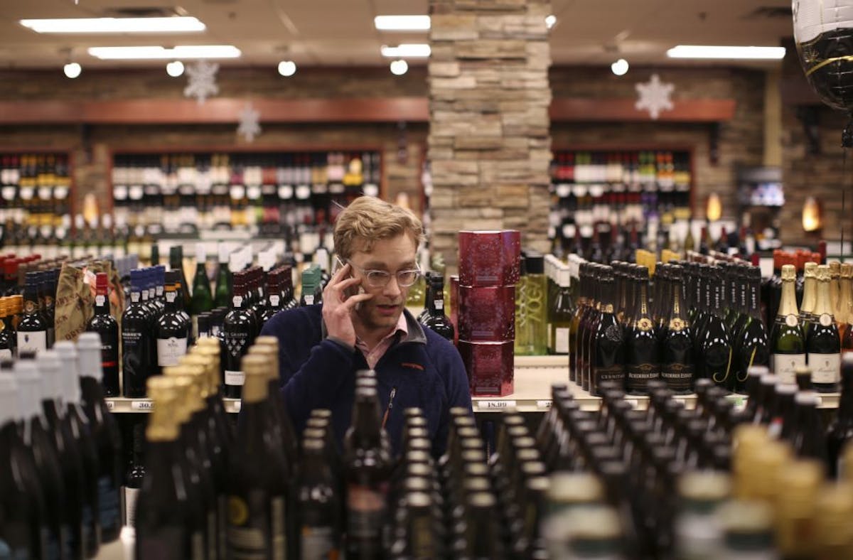 Jesse Martin picked up some beer for New Year's Eve in the Edina Liquor store at 50th & France Wednesday afternoon.