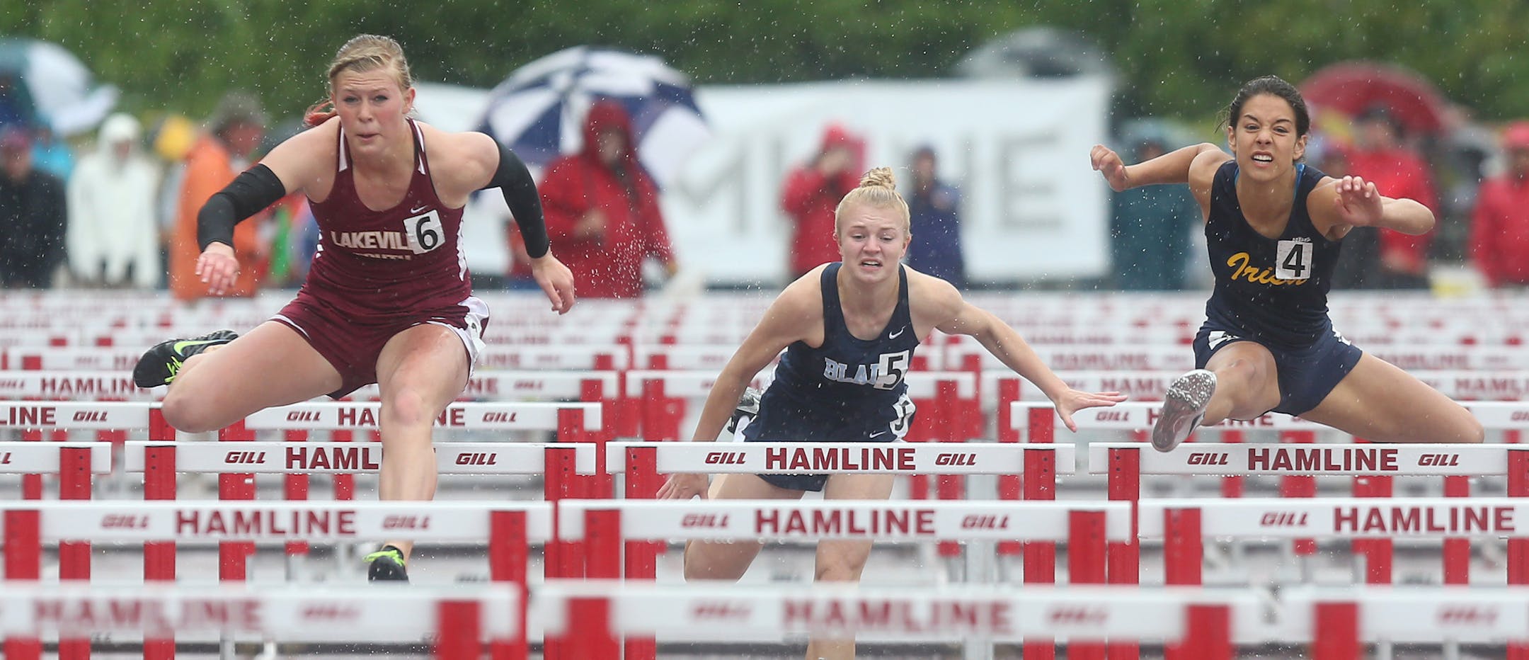 Lakeville South's Shaina Burns tried to pull ahead of Rosemount's Rachel Schow in the 100 meter hurdles. ] (KYNDELL HARKNESS/STAR TRIBUNE) kyndell.harkness@startribune.com During the Class 2A state track and field meet at Hamilne University in St Paul, Min. Saturday, June 7, 2014.