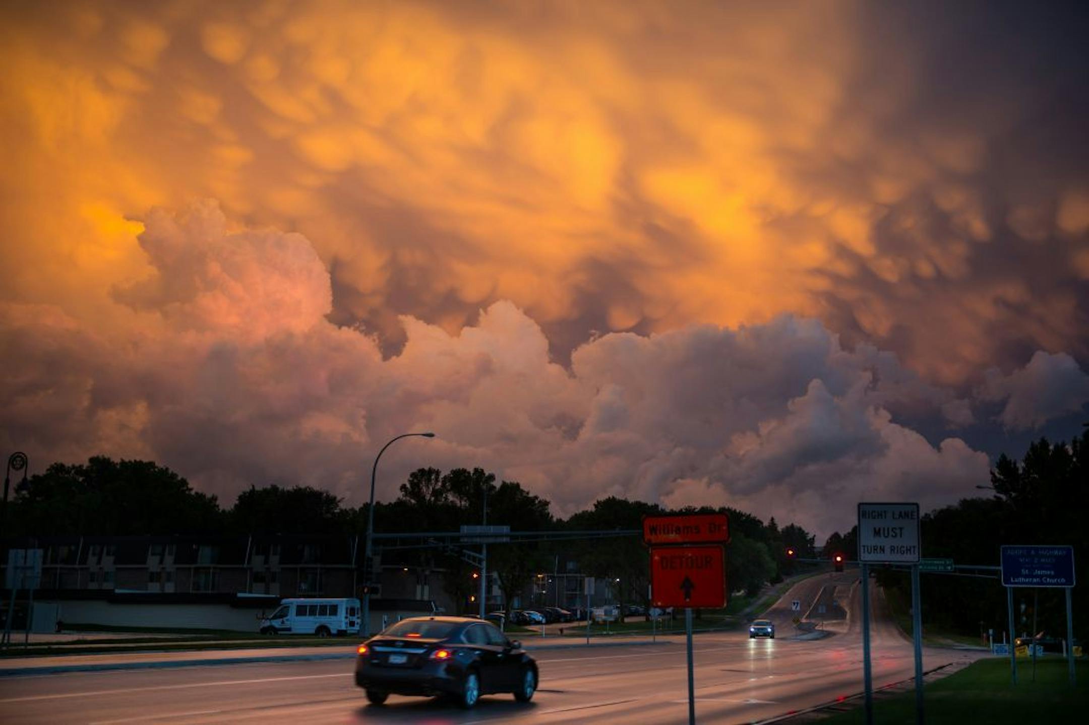 Mammatus clouds formed over northeast of Burnsville at sunset as traffic passed through Highway 13.