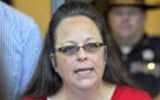 Rowan County Clerk Kim Davis makes a statement to the media at the front door of the Rowan County Judicial Center in Morehead, Ky., on Sept. 14, 2015.
