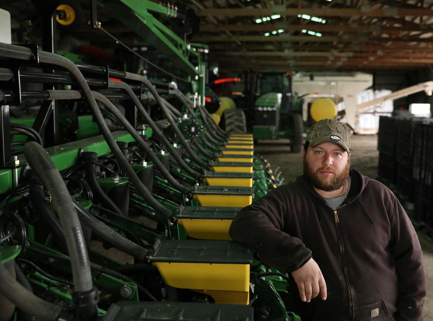 Crop farmer Mike Petefish stood for a portrait alongside a planter in his barn Tuesday. ] ANTHONY SOUFFLE &#xef; anthony.souffle@startribune.com Crop farmer Mike Petefish worked to ready his fields for planing Wednesday, April 6, 2017 in Claremont, Minn. Petefish, who farms 5,000 acres in southern Minnesota, is ready to plant. But mixed with excitement is anxiety about crop prices that have been dropping since 2014 and are below the cost of production. University of Minnesota researchers found t