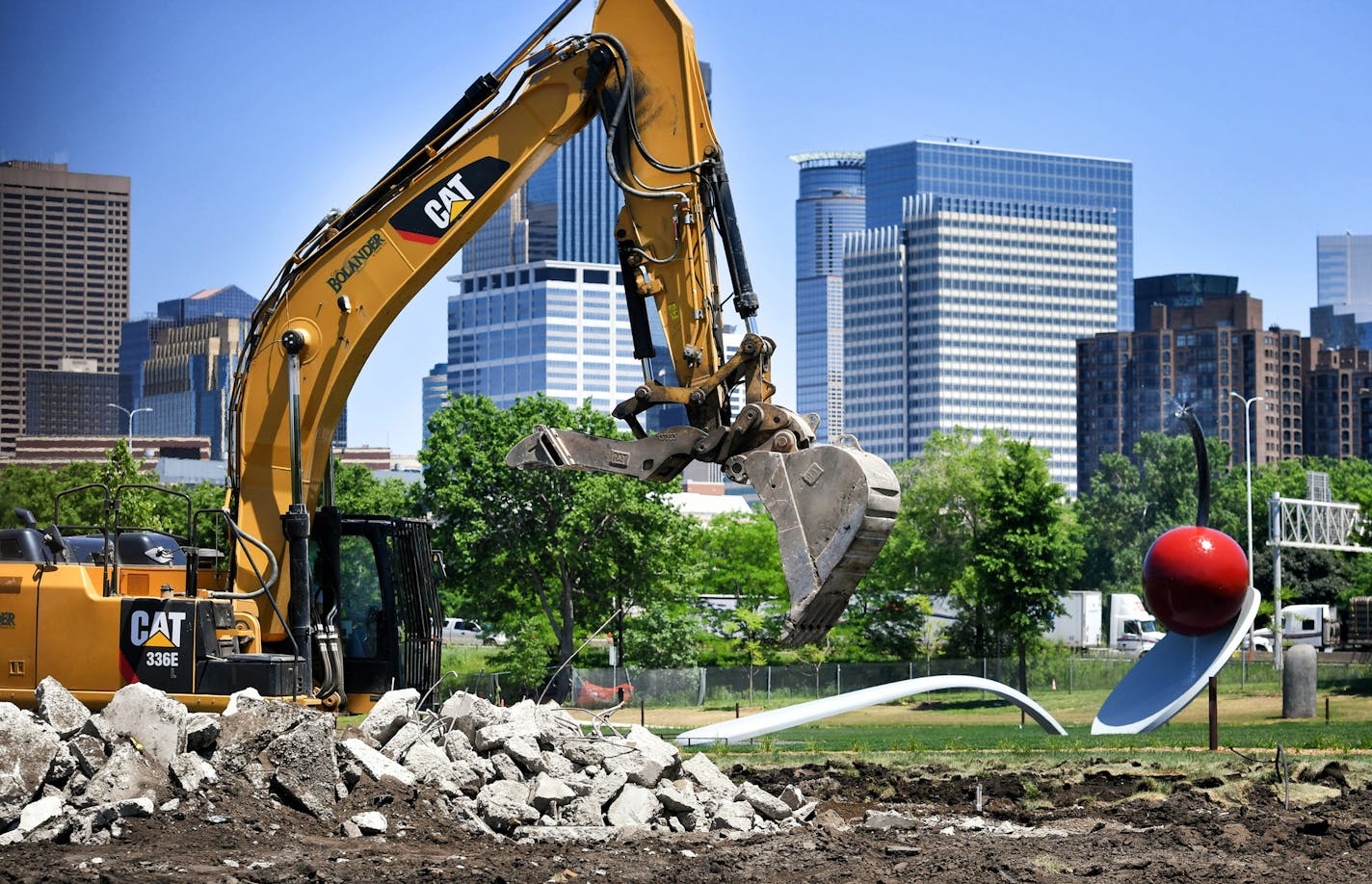 A pile of broken concrete was all that remained of "The Scaffold" sculpture at the Walker Sculpture Garden Tuesday afternoon. "Spoonbridge and Cherry" is in the background. ] GLEN STUBBE &#x2022; glen.stubbe@startribune.com Tuesday June 6, 2017