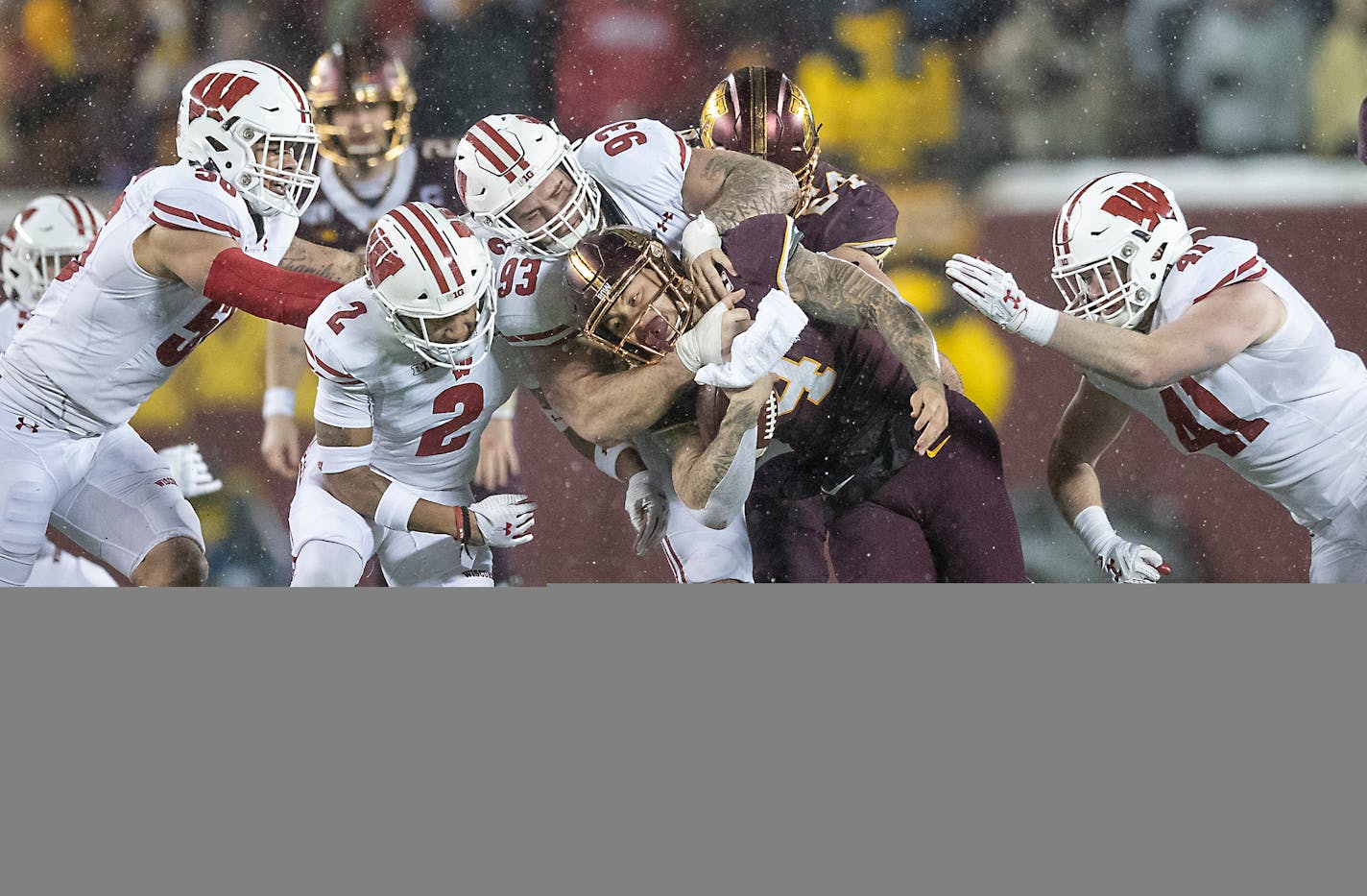 Gophers running back Shannon Brooks ran with the ball before being stopped by the Wisconsin defense during the third quarter.