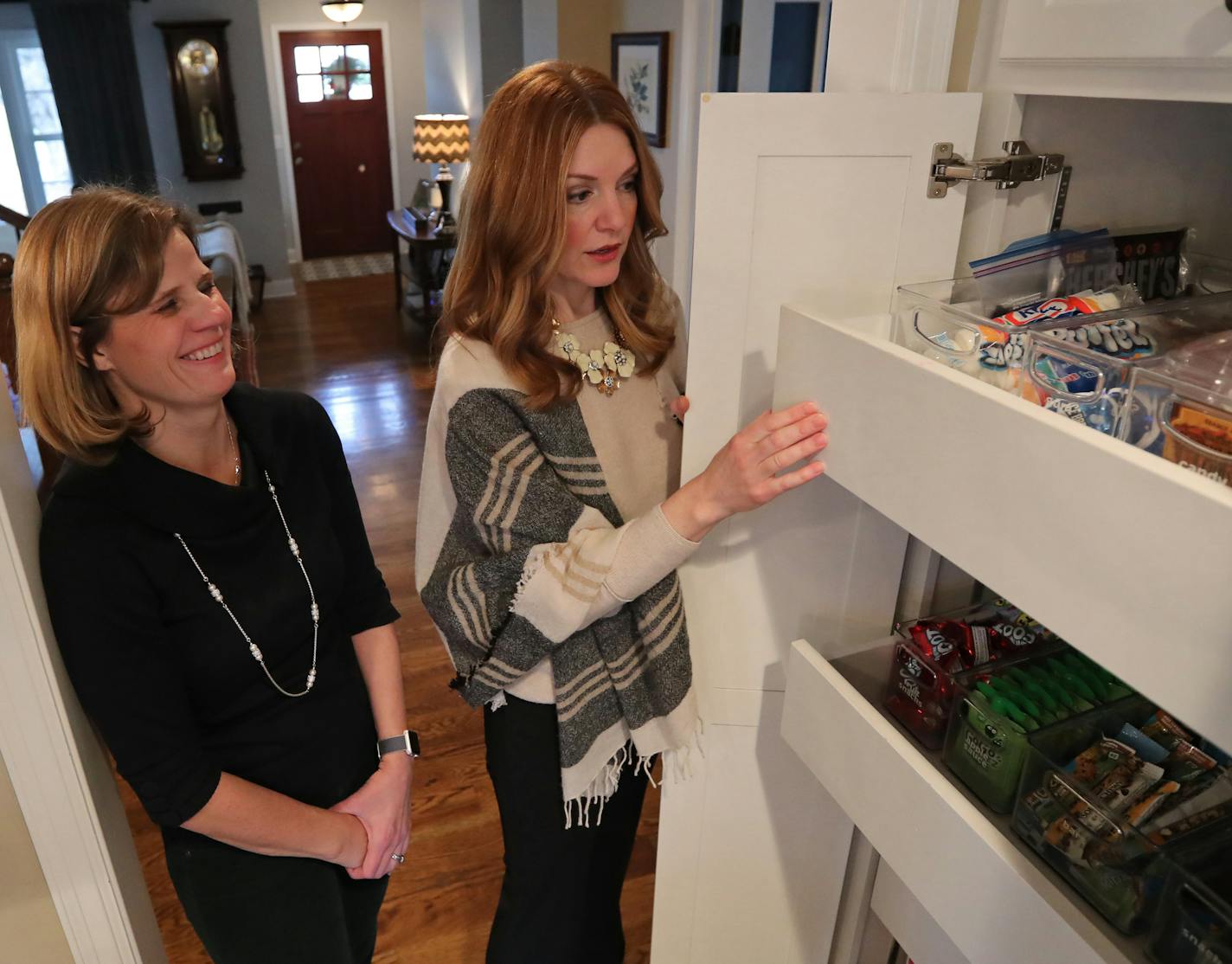 Margaret Kershner's kitchen was organized and decluttered by Michelle Vig (right), the first Marie Kondo-certified organizer in Minnesota.] Shari L. Gross &#xef; shari.gross@startribune.com The first Marie Kondo-certified organizer in MN (a former Caribou Coffee exec) is now helping clients purge items that don't "spark joy." Organizer Michelle Vig will have completed the decluttering and reorganizing of Margaret Kershner's kitchen. This is the "after" photo.