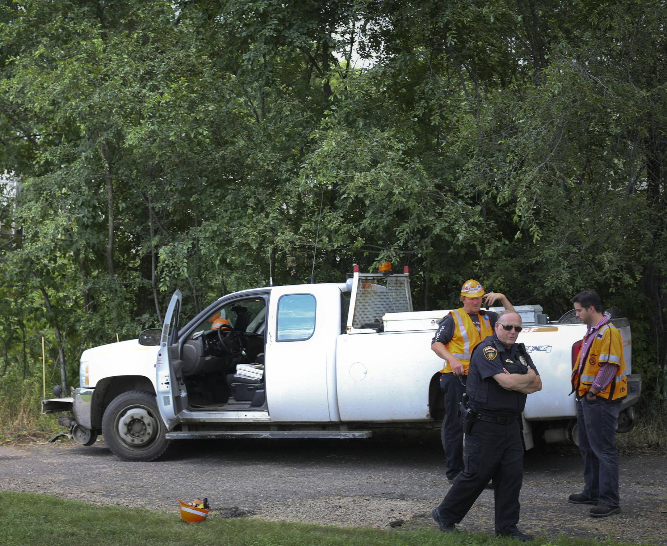 Railroad police investigated the tracks where a 9-year-old severed his feet while playing on a train going through the neighborhood the night before, photographed in St. Paul, Minn. on Friday, August 16, 2013. ] (RENEE JONES SCHNEIDER • reneejones@startribune.com)