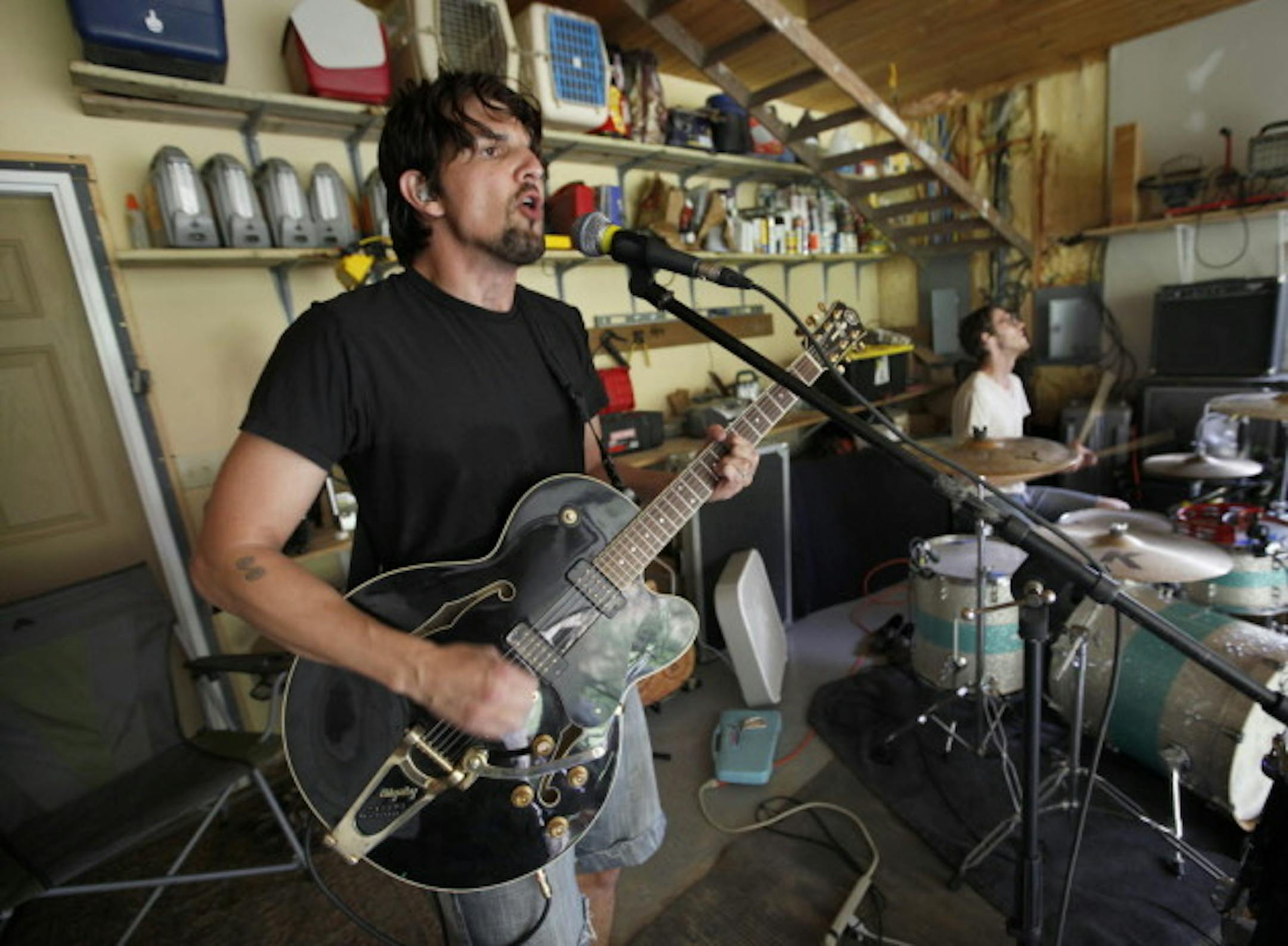 Craig Minowa, left, and Arlen Peiffer will bring Cloud Cult out of the garage again tonight in River Falls, Wis. / Tom Wallace, Star Tribune