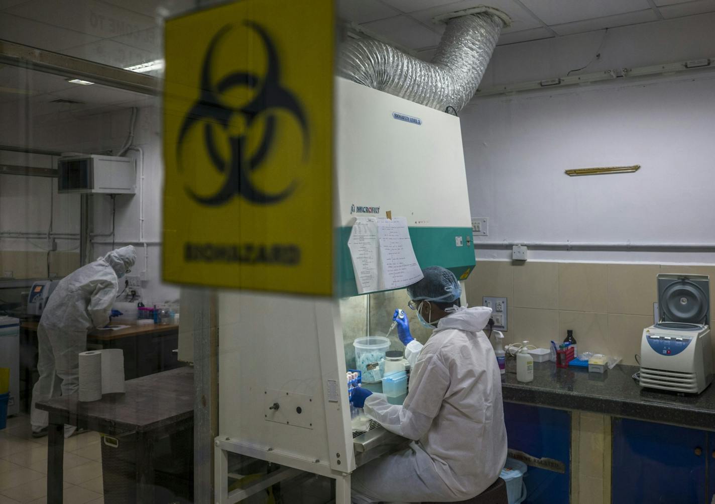 Technicians extract RNA from virus samples at the Covid-19 Molecular Diagnostic Laboratory at the Sant Gadge Baba Amravati University, which sent samples to another laboratory in Pune for genome sequencing. MUST CREDIT: Bloomberg photo by Anindito Mukherjee.