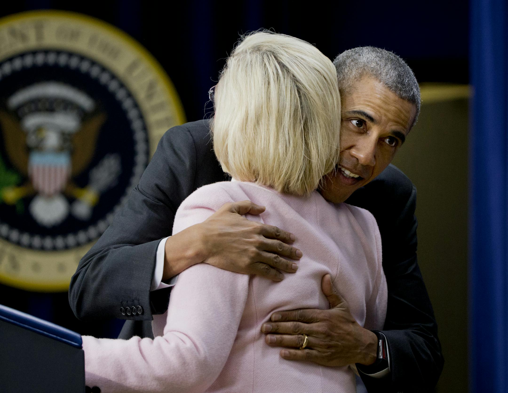President Barack Obama hugs women's rights activist Lilly Ledbetter, in the Eisenhower Executive Office Building on the White House complex in Washington, Friday, Jan. 29, 2016, during a ceremony marking the 7th anniversary of the signing of the Lilly Ledbetter Fair Pay Act. (AP Photo/Manuel Balce Ceneta)