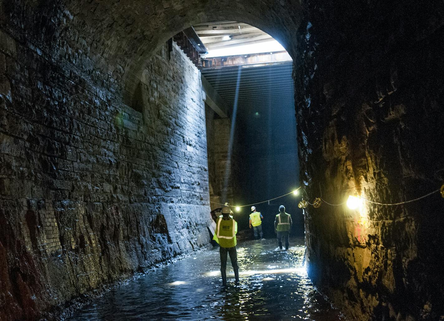 Nineteenth-century tunnels below the Pillsbury A Mill would be retrofitted with modern piping and turbine-generators to produce much of the power for the rehabbed artist housing in the mill complex above. The proposal is one of three pending for hydro development at St. Anthony Falls. credit: Dominium