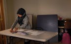 Jehan Hakim sets up a table for voter registration during a service at the Oakland Islamic Center in California, May 20, 2016. As the political climat