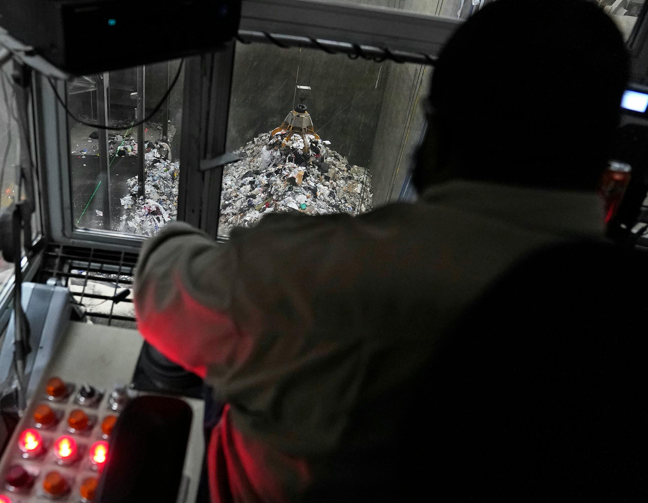 Crane operator Mel Larkins runs a claw that lifts waste trucked in into a boiler to be converted into energy.