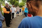 Bishop Harding Smith led a vigil for the victim of a fatal shooting on Plymouth Avenue in north Minneapolis.