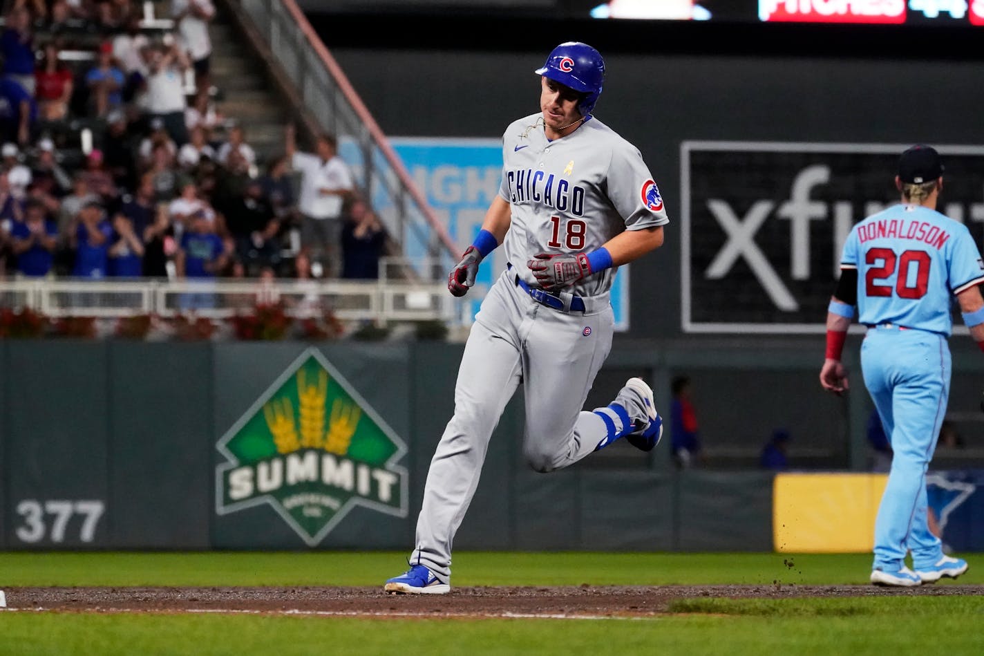 Chicago Cubs' Frank Schwindel runs the bases on his three-run home run off Twins pitcher Joe Ryan during the third inning