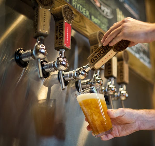 Tom Whisenand, director of operations and co-founder at Indeed Brewing Company, Minneapolis, poured a glass of Indeed pale ale. The beer business is b
