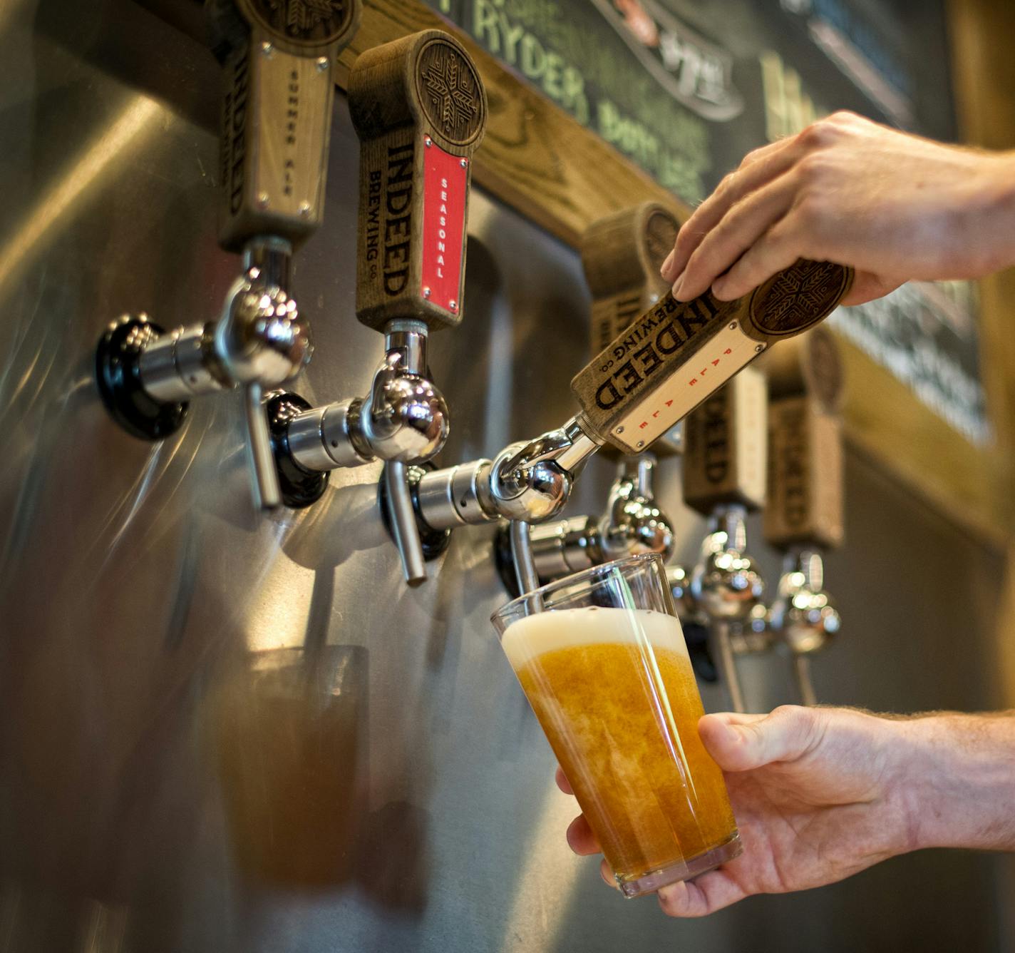 Tom Whisenand, director of operations and co-founder at Indeed Brewing Company, Minneapolis, poured a glass of Indeed pale ale. The beer business is booming in Minnesota, and it was the state Legislature that opened the taps. Since lawmakers allowed brewers to open taprooms on their premises, Minnesota has enjoyed the nation's second-highest growth of craft brewing. Tuesday, June 25, 2013. ] GLEN STUBBE * gstubbe@startribune.com